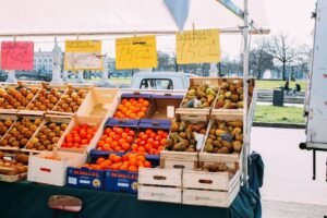 orange fruits in brown cardboard box